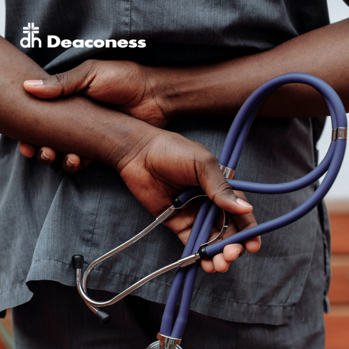 Image of a healthcare professional holding a stethoscope behind their back. Text in the top left corner reads “Deaconess” with their logo.