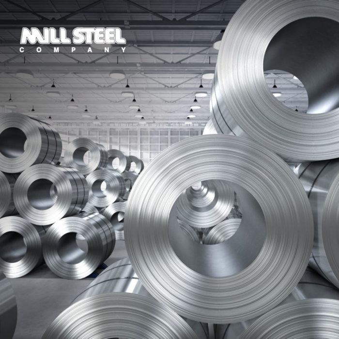 Image of rolled steel stacked within a warehouse building. Text in the top left corner reads “Mill Steel Company”.