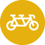 Yellow icon featuring a two-seated bicycle
