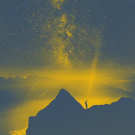 Dark blue mountains with yellow light beaming around. A dark blue man standing on one of the dark blue mountains. Stars above the mountains are yellow.